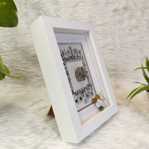 Abundance Frame, Prosperity Frame, Pyrite Abundance Frame, Wealth Attraction Frame, Money Manifestation Frame, Prosperity Words Frame, Feng Shui Pyrite Frame, Pyrite Stone for Wealth, Positive Affirmation Frame, Abundance and Prosperity Decor, Wealth Energy Frame, Home Decor for Prosperity, Manifestation Frame with Pyrite, Pyrite Crystal Wealth Frame, Money Attraction Decor, Spiritual Prosperity Frame, Office Decor for Abundance, Pyrite Crystal for Wealth, Abundance Affirmation Art, Prosperity and Wealth Energy Frame, "Abundance Frame with prosperity words and a pyrite stone for wealth manifestation.", "Pyrite stone inside an Abundance Frame, designed for attracting prosperity and positive energy.", "Decorative frame with abundance and prosperity affirmations, featuring a wealth-attracting pyrite crystal.", "Manifest abundance and wealth with this elegant frame featuring a pyrite stone and prosperity words.", "Abundance and prosperity affirmation frame with pyrite stone for energy cleansing and wealth attraction.", "Pyrite crystal framed with prosperity and abundance words for home or office decor."